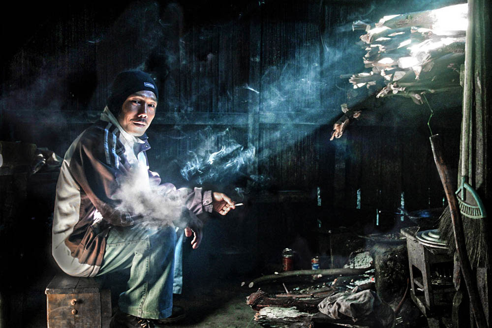 A miner in his kitchen after a long working day.